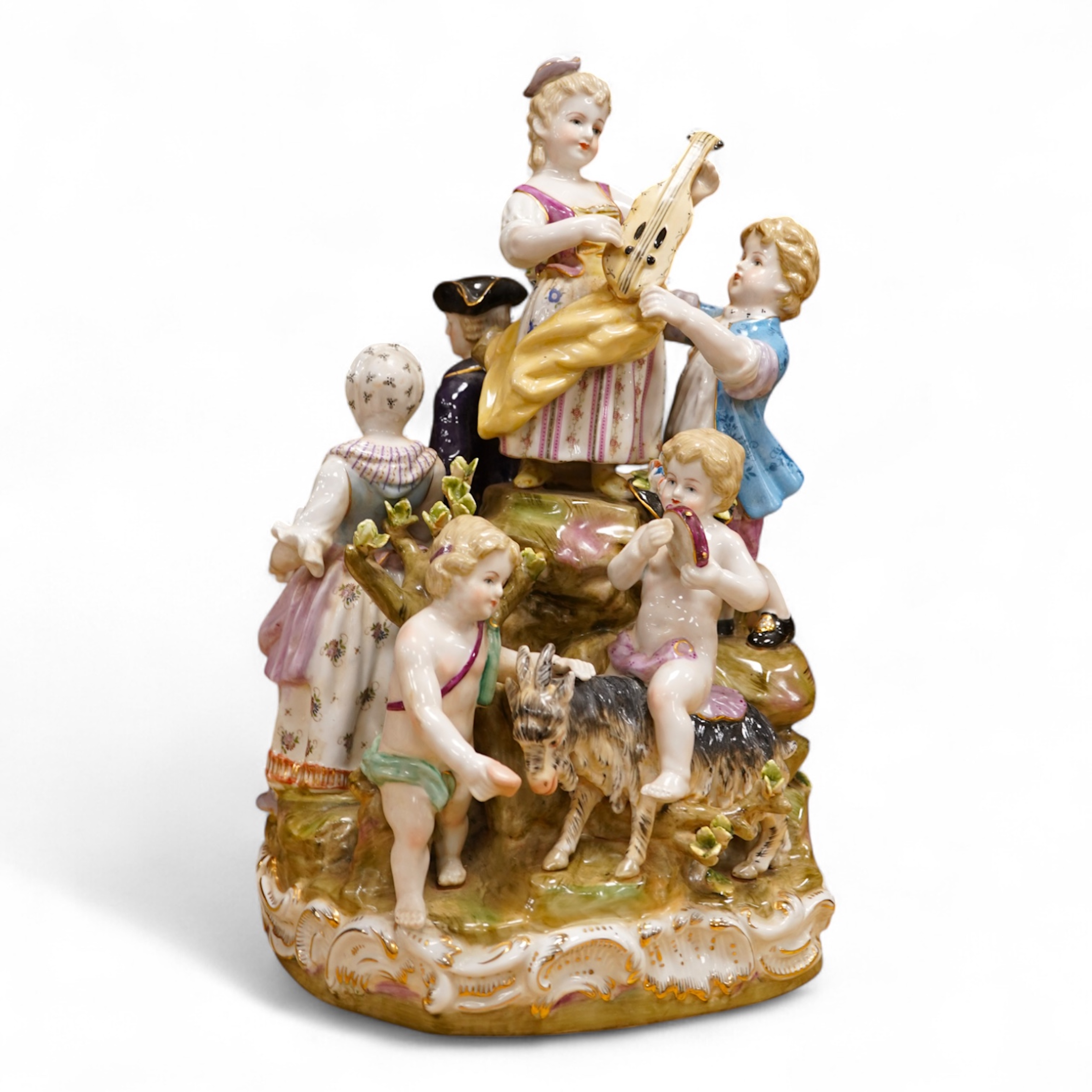 A large German porcelain group, figures playing instruments, 35cm high